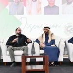 Federal Minister Chaudhry Salik Hussain addressing members of the Pakistani business community during an interactive discussion organized by Pakistan Business Council Sharjah, focusing on overseas Pakistanis' welfare, workers' rights, and employment opportunities.