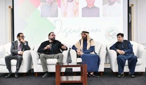 Federal Minister Chaudhry Salik Hussain addressing members of the Pakistani business community during an interactive discussion organized by Pakistan Business Council Sharjah, focusing on overseas Pakistanis' welfare, workers' rights, and employment opportunities.