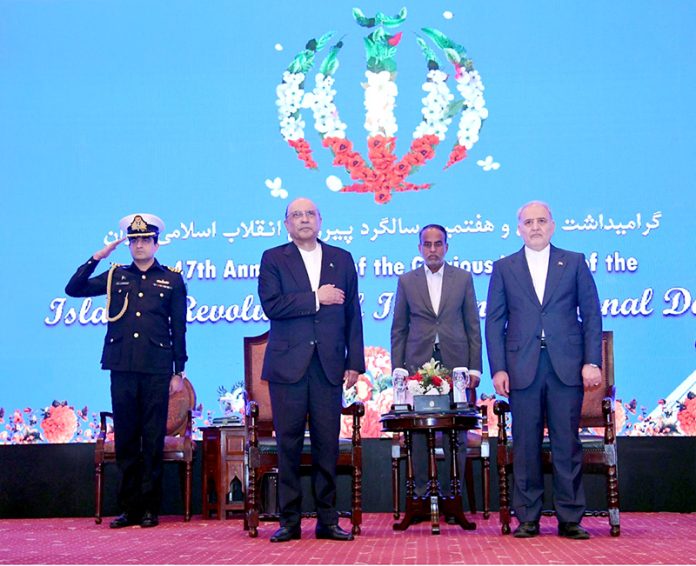 President Asif Ali Zardari and Ambassador of Iran Dr. Reza Amiri Moghaddam stand as the National Anthems of Pakistan and Iran are played at a reception to commemorate the 47th Anniversary of the Victory of the Islamic Revolution of Iran and Iran’s National Day