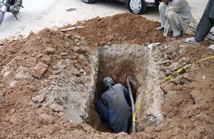 Labourers are digging and clearing soil to lay cable in the Federal Capital.