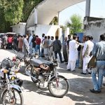–Journalists and locals wait for their turn to register their vehicles for M-Tag at the National Press Club (NPC) as the mandatory vehicle registration campaign with M-Tags continues across the Federal Capital.