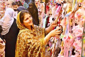 Women are busy selecting and purchasing bangles from a shop at local market in connection with upcoming Eidul Fitr.