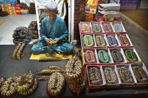 A worker is busy giving the final touches to bangles for delivery to other cities at the Bangles Market in preparation for the upcoming Eidul Fitr.
