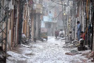 Youngsters playing in the rain water in the street after rain that experienced the Federal Capital.