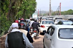 Workers are seen busy installing security cameras in Bhara Kahu to enhance surveillance
