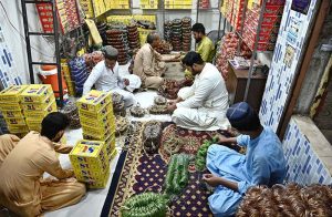 A worker is busy giving the final touches to bangles for delivery to other cities at the Bangles Market in preparation for the upcoming Eidul Fitr.
