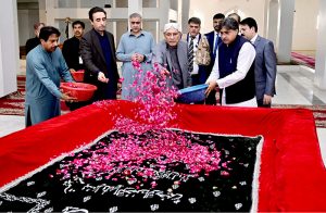 President Asif Ali Zardari along with Chairman Pakistan People’s Party, Bilawal Bhutto Zardari showering flowers on grave of Shaheed Mohtarma Benazir Bhutto on the third day of Eid al-Fitr at Garhi Khuda Bakhsh