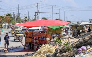 A view of hand carts encroaching on the roadside creating hurdles in the flow of traffic at the main bus terminal Pirwahdi neighborhood in the city.