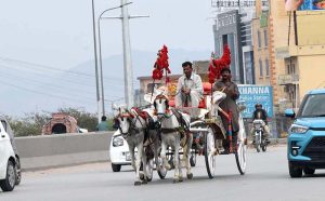 Workers are seen busy installing security cameras in Bhara Kahu to enhance surveillance