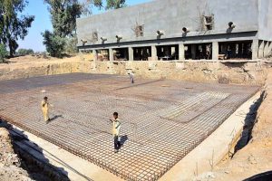Workers are busy construction work of water filtration plant at Latifabad, Unit Number 04 during development work in the city.