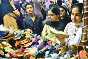 Women are busy selecting and purchasing bangles from a shop at local market in connection with upcoming Eidul Fitr.