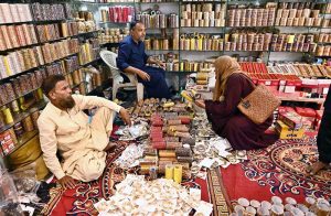 A worker is busy giving the final touches to bangles for delivery to other cities at the Bangles Market in preparation for the upcoming Eidul Fitr.