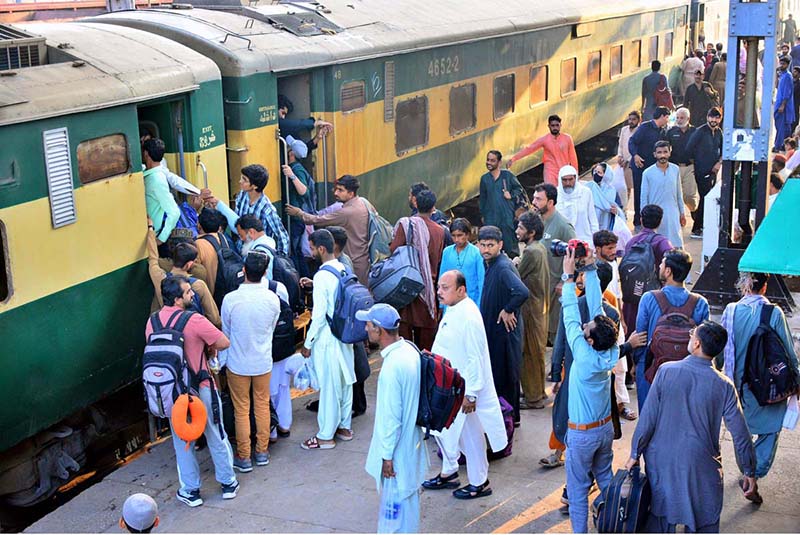 People boarding on train at Railway Station to leave for their hometowns to celebrate Eid-ul-Fitr with their loved ones