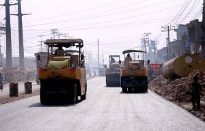 Heavy machinery being used for construction work during the ongoing development project on Vehari Road