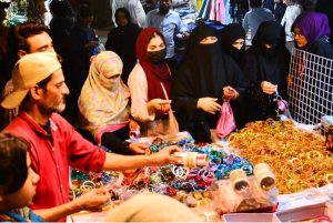 A large number of women busy shopping at a local market ahead of Eid-ul-Fitr.