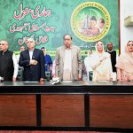 Federal Minister for Information and Broadcasting Attaullah Tarar stands during the national anthem at a ceremony marking the fourth death anniversary of former President Muhammad Rafique Tarar at Nazariya Pakistan Trust