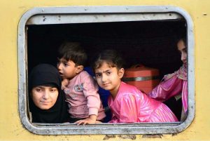 People boarding on train at Railway Station to leave for their hometowns to celebrate Eid-ul-Fitr with their loved ones