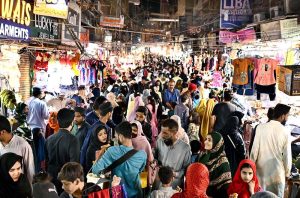 A large number of people busy shopping for preparation of upcoming Eid-ul-Fitr at Resham Bazaar.