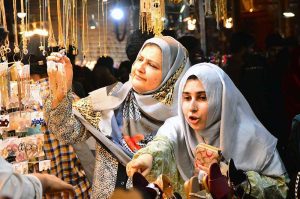 Girls are busy selecting and purchasing cosmetics items from vendor stall at local market in connection with upcoming Eidul Fitr.