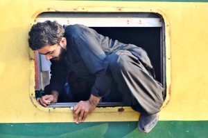 People boarding on train at Railway Station to leave for their hometowns to celebrate Eid-ul-Fitr with their loved ones
