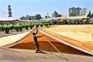 Labourers busy installing tent for Eidul Fitr prayer at Eid Gah Masjid