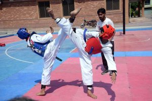 Female Players in action during Faisalabad Division Inter Club Taekwondo Championship 2026 organised by Faisalabad Division Taekwondo Association at Crescent Sports Complex.