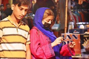 Women busy purchasing ladies’ suits from a vendor stall at the Ramazan Bachat Bazaar while preparing for the upcoming Eid-ul-Fitr during the holy month of Ramazan at Unit No.8 Latifabad .