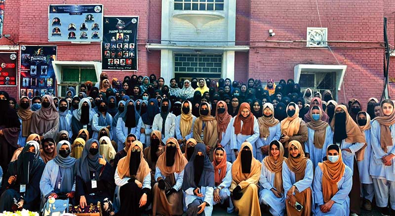Dr. Qaiser Jabeen, Dean Faculty of Allied Health Sciences with professors in a group photo with students at a ceremony held to mark International Women’s Day at The Islamia University of Bahawalpur