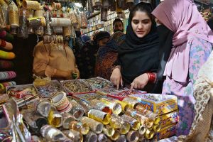 Women are busy selecting and purchasing bangles from a stall in a local market in connection with upcoming Eidul Fitr.