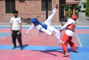 Female Players in action during Faisalabad Division Inter Club Taekwondo Championship 2026 organised by Faisalabad Division Taekwondo Association at Crescent Sports Complex.