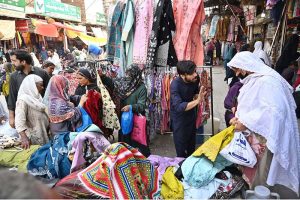 Women are busy selecting and purchasing bangles from a stall in a local market in connection with upcoming Eidul Fitr.