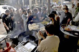 An elderly faithful offering dua after the Eidul Fitr prayer at Eidgah Sharif