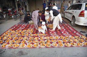A view of an iftar dastarkhwan arranged to provide free iftar meals to fasting and deserving people during the holy month of Ramazan at Khyber Bazar Chowk.