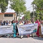 Vice Chancellor GCWUF Prof. Dr. Kanwal Ameen leads an awareness walk organized by the Department of Botany in collaboration with the Green & Clean Society at the university campus