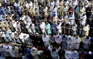 A large number of faithful offer Friday prayers during holy fasting month of Ramazan at Eidgah Masjid.
