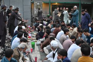 Volunteers serving free food to the people breaking fast during Iftar in the holy month of Ramazan ul Mubarak at I-9 sector.