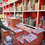 A young vendor displaying colorful bangles to attract the customers at G-9 Market in connection with Eidul Fitr