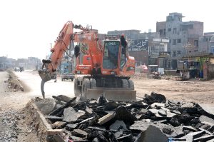 Repairing work of Sargodha Road with the help of heavy machinery during development work in the city.
