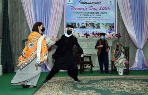 Female students presenting tableau on stage during International Women's Day organized by Hum Log at Govt. Frontier College for Women