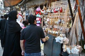 A young vendor displaying colorful bangles to attract the customers at G-9 Market in connection with Eidul Fitr