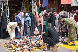 A large number of people busy in shopping at Jhang Bazaar ahead of Eidul Fitr