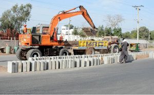 Construction work on the divider line of Vehari Road is underway as part of ongoing development in the city.