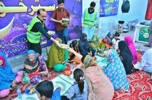 Volunteers distribute Iftari to differently-abled persons at the Association for the Welfare of Handicap Persons during an Iftar Dastarkhwan organized by SDYC in the holy month of Ramazan.