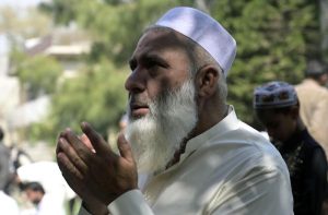 A large number of faithful offer Friday prayers during holy fasting month of Ramazan at Eidgah Masjid.