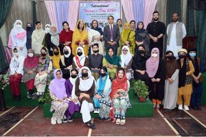 Chairman Hum Log Augustin Jacob poses in a group photo with officials and participants during International Women’s Day at Government Frontier College for Women