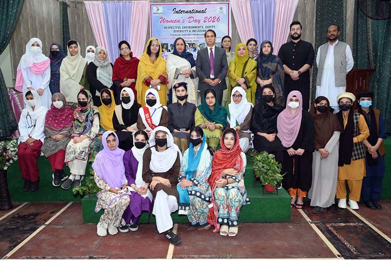 Chairman Hum Log Augustin Jacob poses in a group photo with officials and participants during International Women’s Day at Government Frontier College for Women