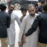 Security officials checking faithful arriving for offering Juma-tul-Wida (last Friday prayer) during the holy month of Ramazan at Markazi Jamia Masjid