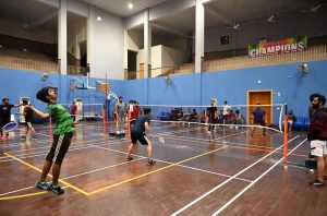 Players in action during the Badminton Championship organized by the Sports Department as part of the Ramadan Night Sports Festival at the Sports Gymnasium, under the guidance of Deputy Commissioner Hussain Ahmed Raza.