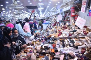 Women purchasing bangles and jewelries during Eid shopping at Hyderi Market.