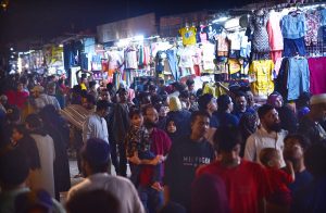 Women purchasing bangles and jewelries during Eid shopping at Hyderi Market.